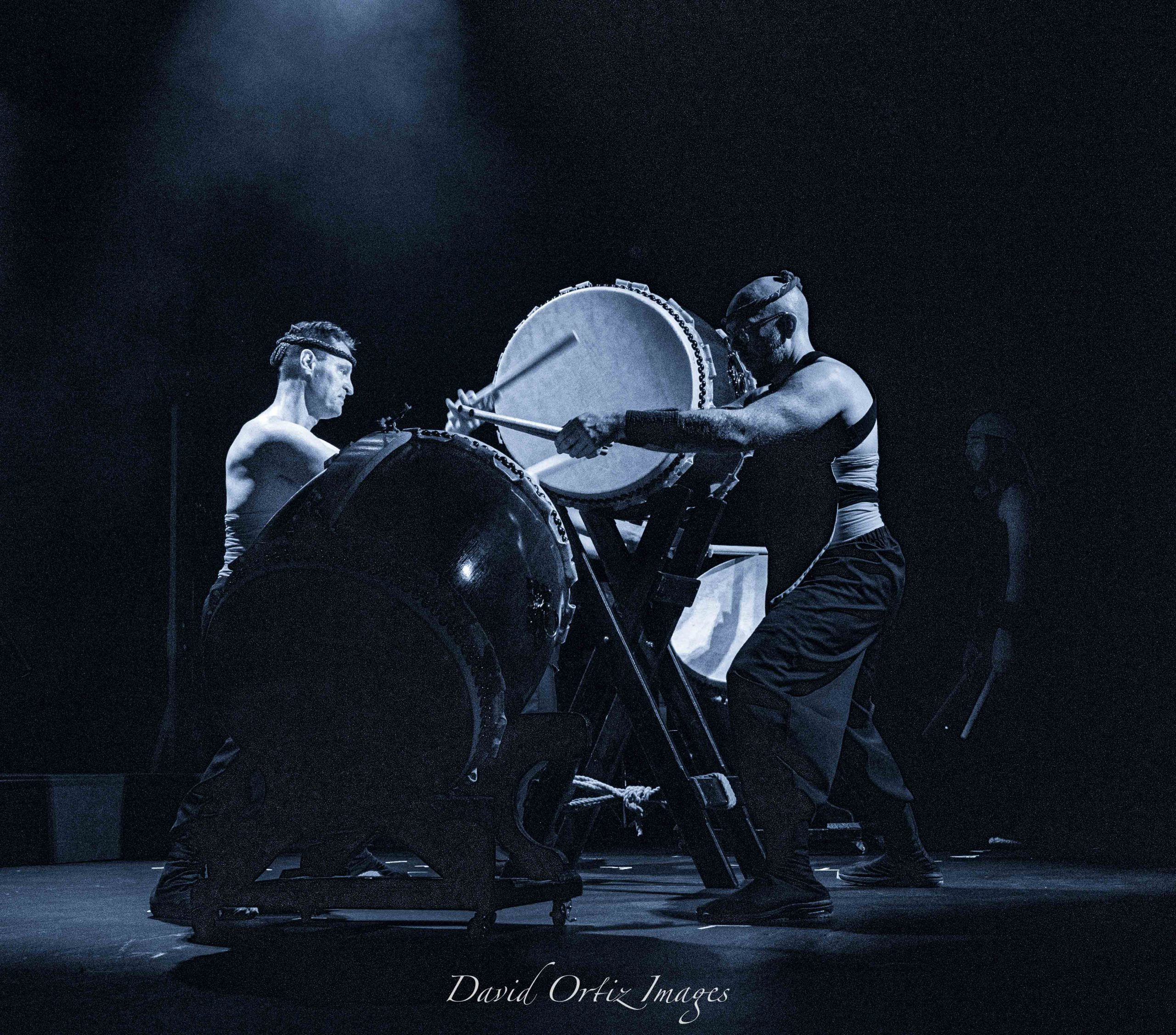 Two men playing taiko drums